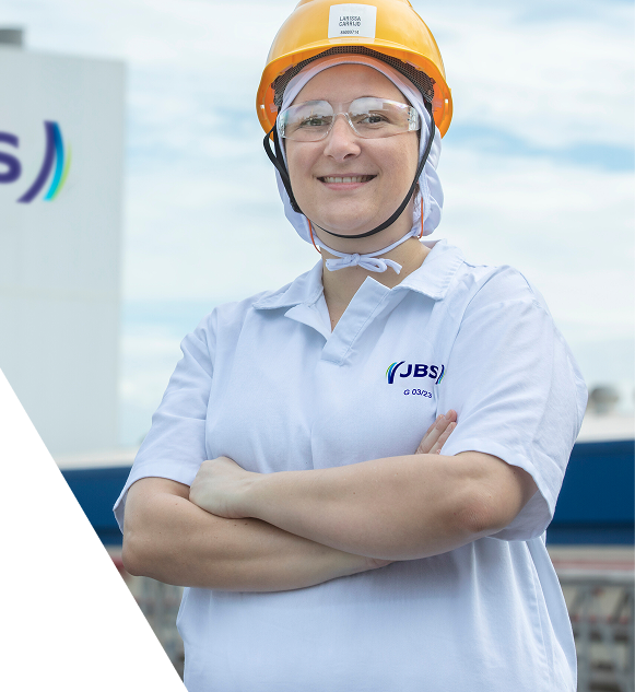 Food production employee wearing hardhat and protective equipment