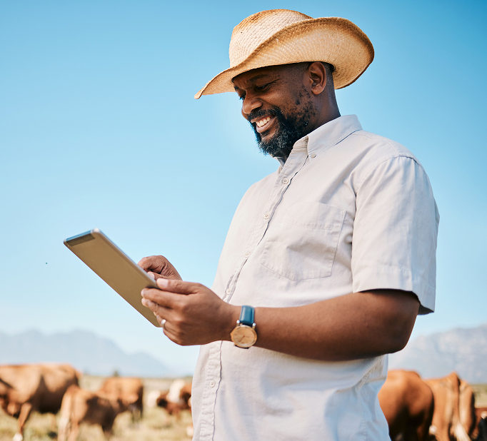 Agricultural supply-chain professional using digital information outdoors